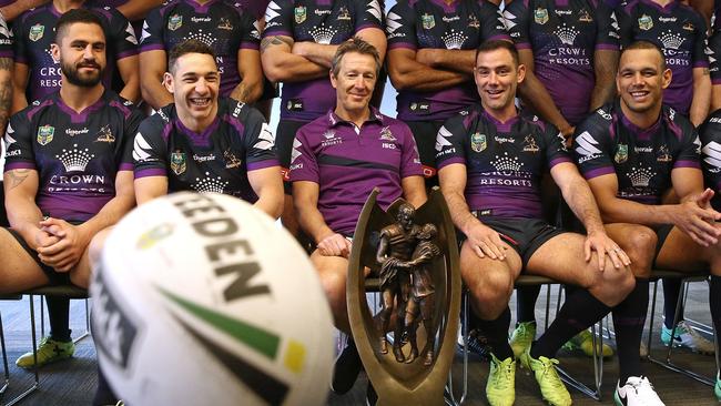 Prop Jesse Bromwich, fullback Billy Slater, coach Craig Bellamy, captain Cameron Smith and centre Will Chambers pose for the Melbourne Storm team photo.