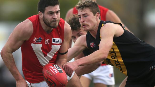 Rooster Ben Jarman dishes out a handball against Glenelg. Picture: Dean Martin/AAP