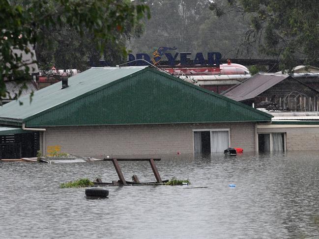 A general view shows a flooded residential area near Windsor on March 22, 2021, as torrential downpours lashed Australia's east forcing thousands to flee the worst flooding in decades. (Photo by Saeed KHAN / AFP)