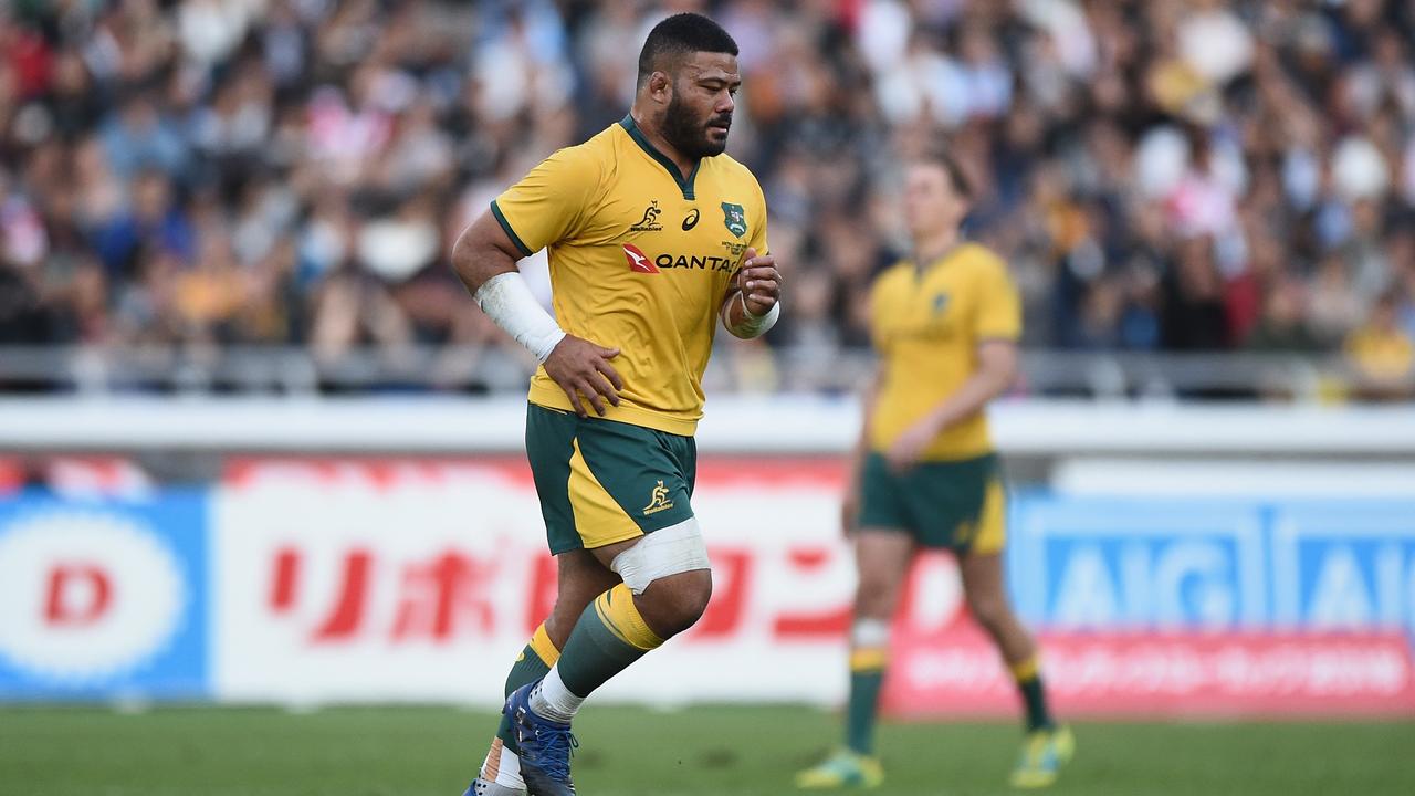 Tolu Latu of the Wallabies leaves the field after receiving a yellow card.