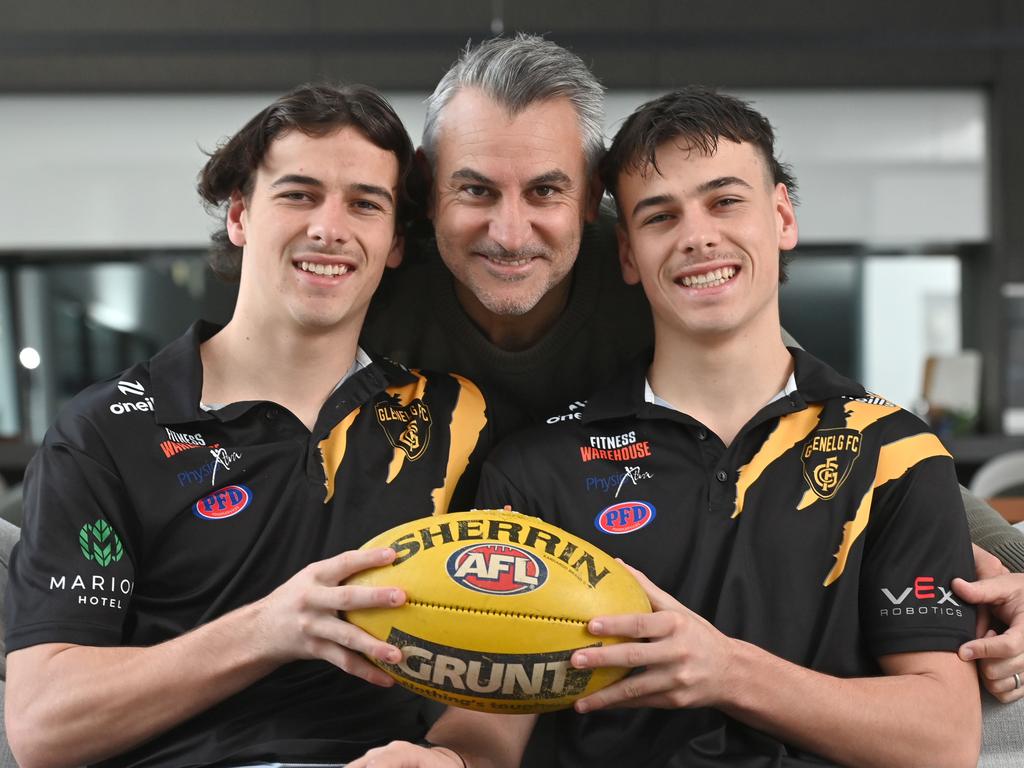 Former Carlton AFL footballer Scott Camporeale with his twin boys and rising footy stars, Glenelg's Ben and Lucas Camporeale, who should be in their Glenelg gear, with a footy etc. Get nice, smiling pic with Scott in middle please.