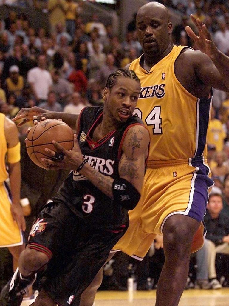 JUNE 6, 2001 : Philadelphia 76ers Allen Iverson (ball) drives by Los Angeles Lakers Shaquille O'Neal (R) during the second half of the NBA Finals Game 1 at the Staples Centre in Los Angeles, 06/06/01. Basketball A/CT