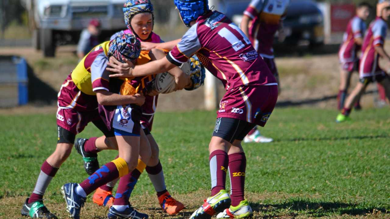 ZONE IN: Roma U12 players work together to tackle a Jandowae player at the Zone 4 Rugby League Carnival in Roma. Picture: Molly Hancock