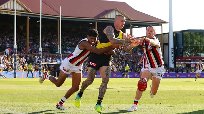 Dustin Martin of the Tigers and Nasiah Wanganeen-Milera of the Saints and Callum Wilkie of the Saints during the 2024 AFL Round 04 match between the Richmond Tigers and the St Kilda Saints at Norwood Oval on April 07, 2024 in Adelaide, Australia. Picture: Sarah Reed/AFL Photos via Getty Images