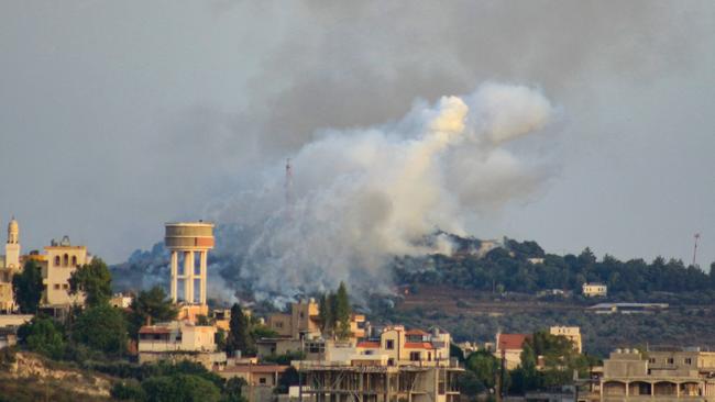 Smoke billows from a site targeted by Israeli shelling in the southern Lebanese village of Dhayra.