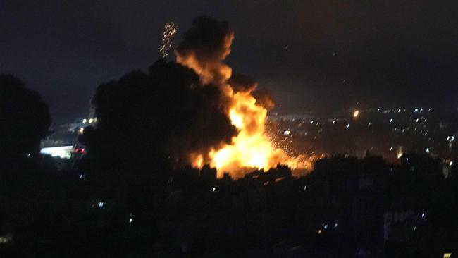 Flames rise from Israeli airstrikes in Dahiyeh, Beirut, Lebanon, Friday, Oct. 4, 2024. (AP Photo/Hussein Malla)