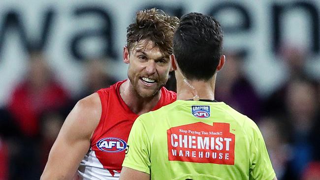 Rampe argues with the umpire after being caught holding the ball. Picture: Phil Hillyard