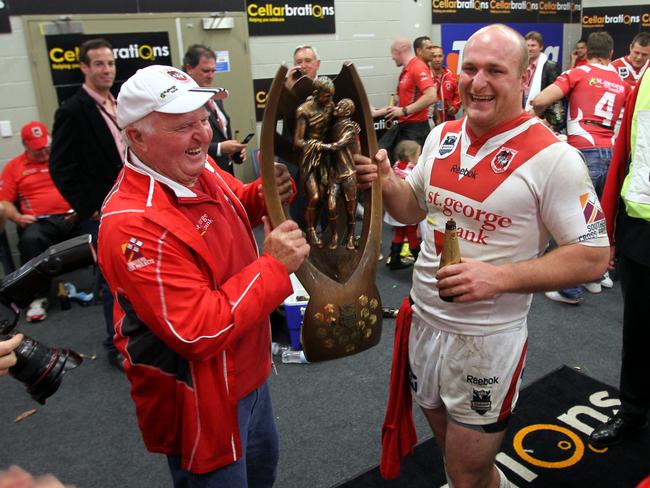 In safe hands: Michael Weyman with the trophy in the Olympic Park sheds.