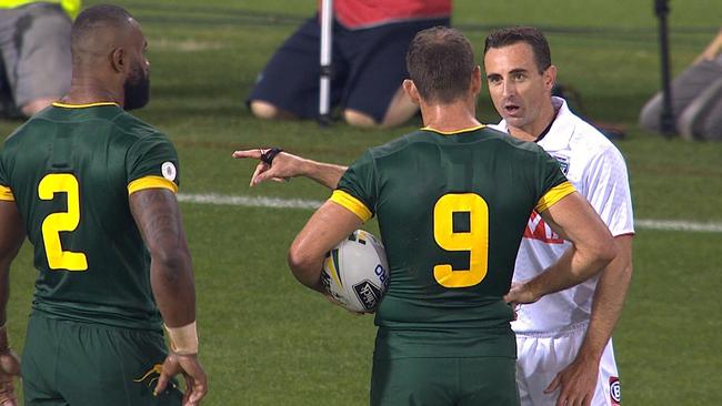 Referee Gerard Sutton speaks to Australian captain Cameron Smith and Semi Radradra.