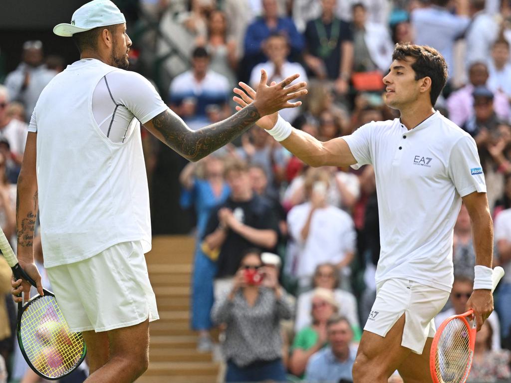 Nick Kyrgios shakes hands with Chile's Cristian Garin after their men's singles quarter final at Wimbledon. Picture: AFP