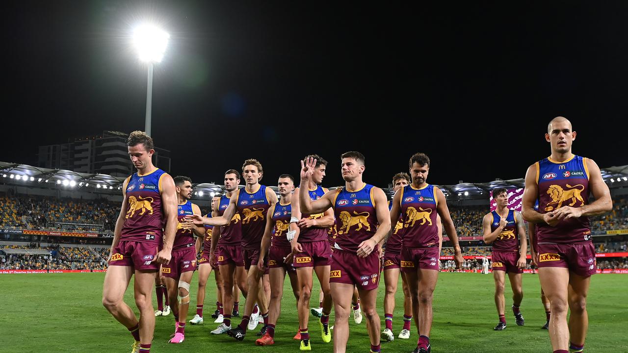 BRISBANE, AUSTRALIA - MARCH 28: Brisbane Lions leave the field after their defeat during the round three AFL match between Brisbane Lions and Collingwood Magpies at The Gabba, on March 28, 2024, in Brisbane, Australia. (Photo by Albert Perez/AFL Photos via Getty Images )