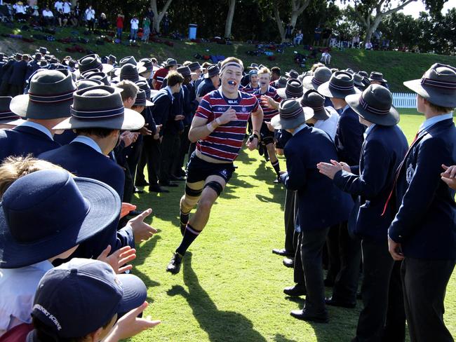 GPS rugby match between Brisbane Grammar and The Southport School - TSS players run onto the field. Picture: AAP/David Clark