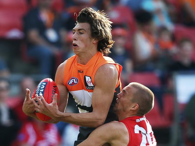 Greater Western Sydney's Caleb Marchbank takes strong mark ahead of Sydney Swans' Sam Reid during AFL match GWS Giants v Sydney Swans at Spotless Stadium. Picture. Phil Hillyard
