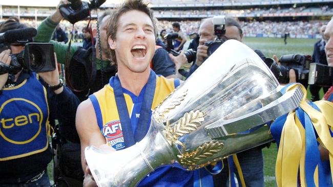 Ben Cousins holds the 2006 premiership cup.