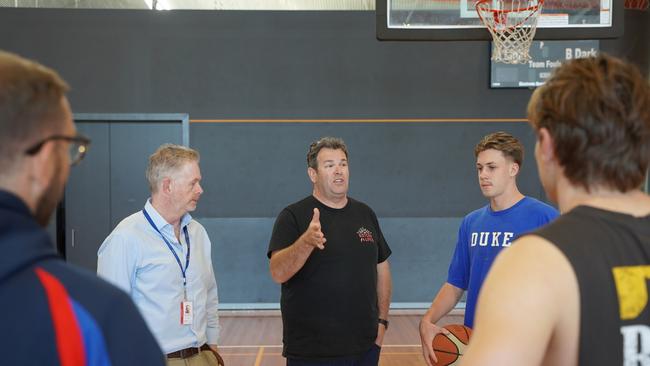 Gus Worland, the founder of Gotcha4Life Gus Worland (centre) talking to basketball players and officials at the Northern Beaches Police Citizens Youth Club at Dee Why. Picture: NSW PCYC