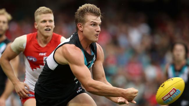 Ollie Wines, Port’s best against Sydney, fires out a handpass at the SCG. Picture: Mark Kolbe (Getty Images)