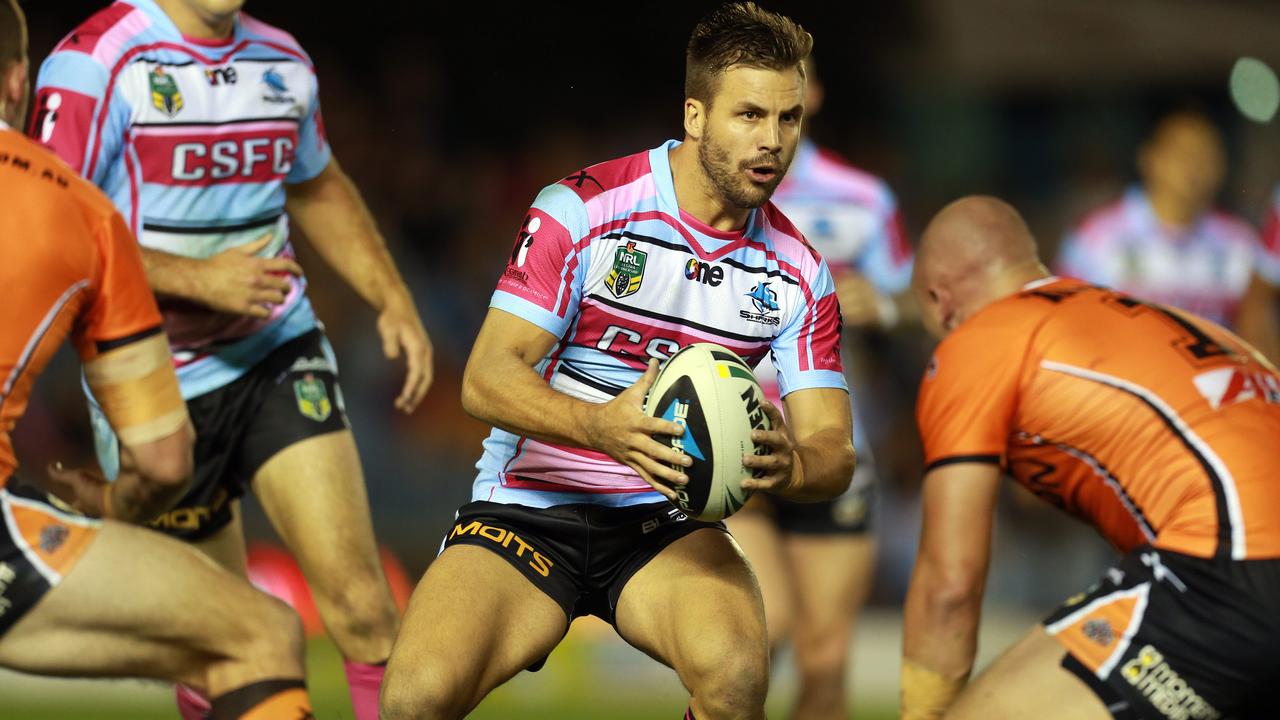 Ryan in action for the Cronulla Sharks against West Tigers in 2014.