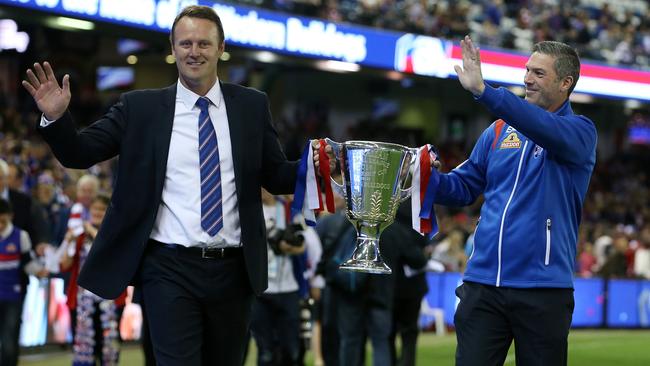 Chris Grant and Rohan Smith carry the 2016 premiership cup. Picture: Michael Klein