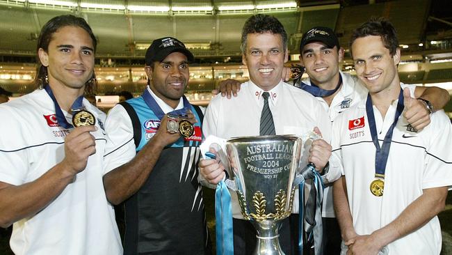 Port coach Mark Williams in the centre of the MCG with Peter Burgoyne, Byron Pickett, Shaun Burgoyne and Gavin Wanganeen.