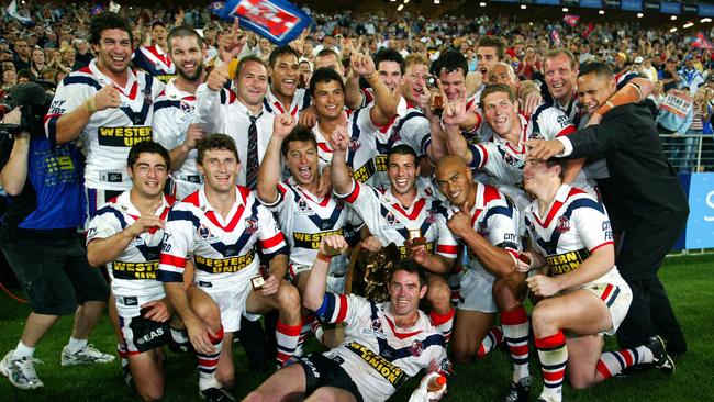 Stuart and his victorious players after the Roosters beat the Warriors in 2002.