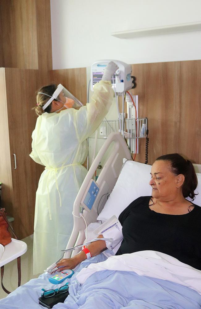 Registered nurse Dawn Medan tends to Covid-positive patient Charmaine Pangi at Mackay Base Hospital. Picture: Contributed