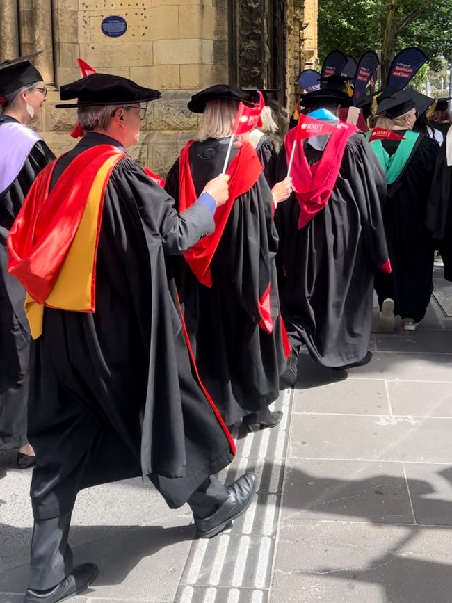 Graduates in the graduation parade walk around the RMIT University Melbourne Campus on Wednesday, December 18, 2024. Picture: Jack Colantuono