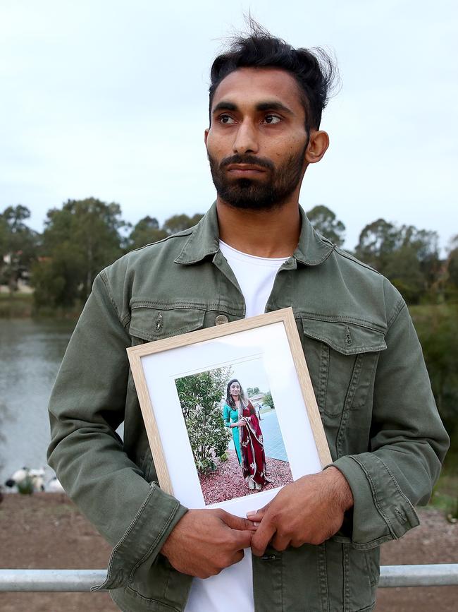 Jaspreet Singh holding a picture of his sister. Picture: Toby Zerna