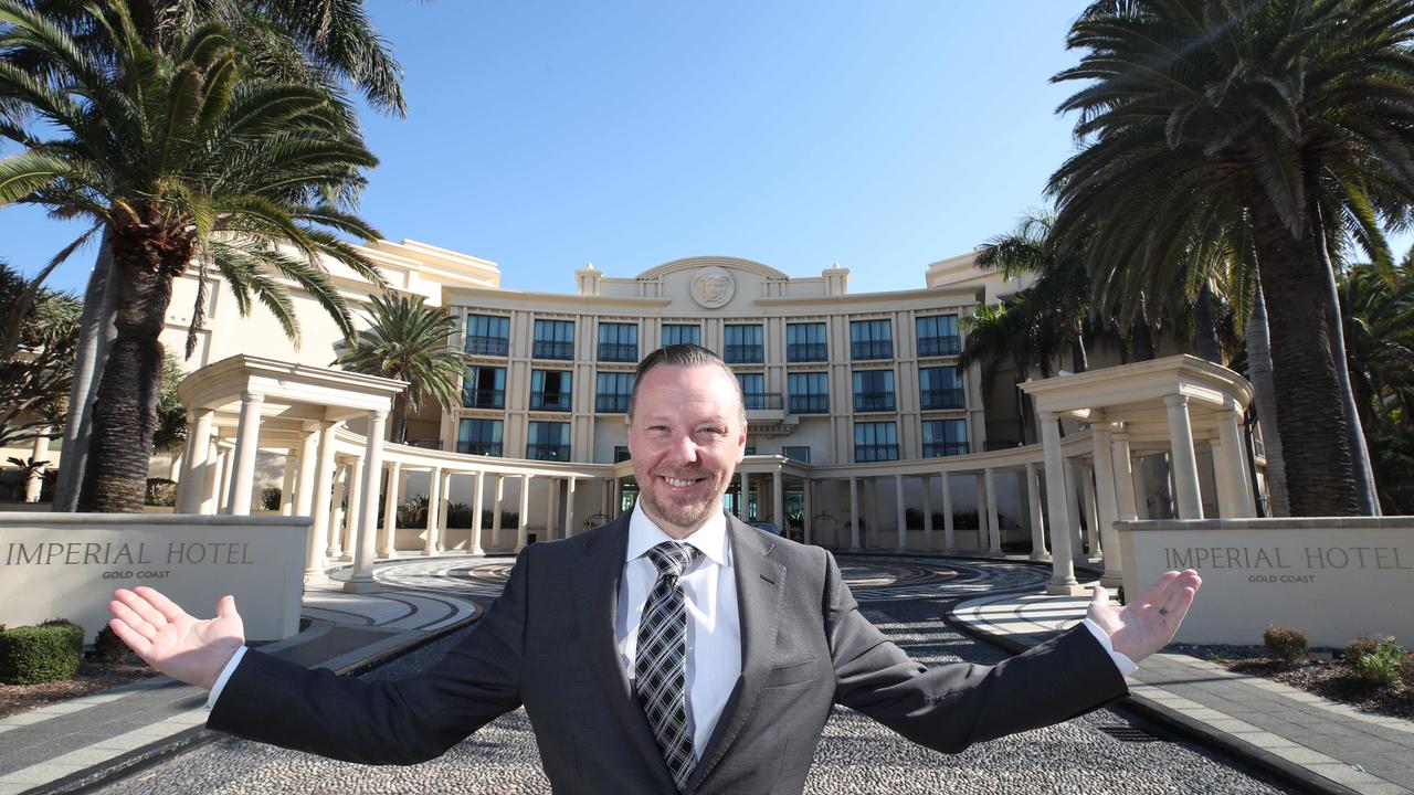 Richard Clarke with the new Imperial Hotel signage at the hotel formerly known as Palazzo Versace. Picture: Glenn Hampson.