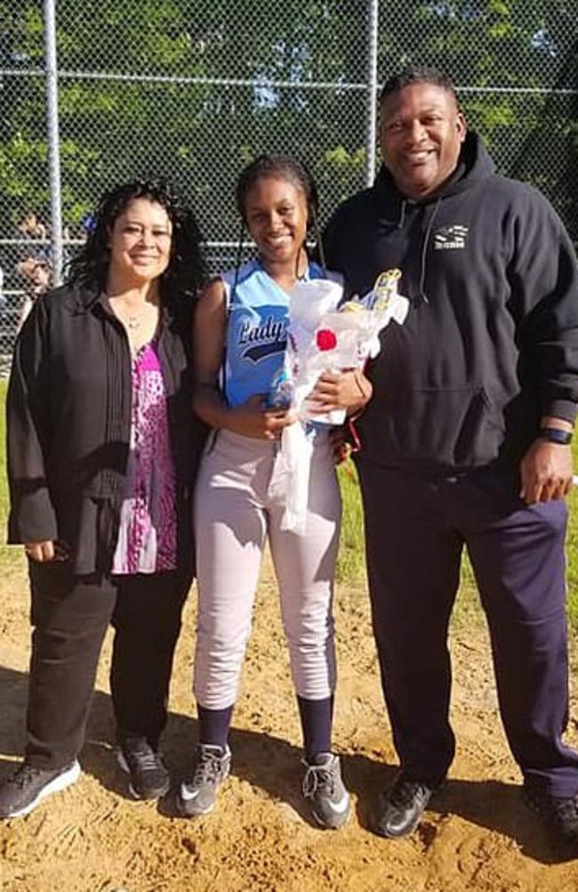 Nicole Pyles (above, centre, with her parents) had worn the African-American hairstyle in previous games.