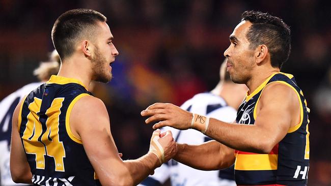 Lachlan Murphy celebrates a goal with Crows teammate and forward line mentor Eddie Betts. Picture: Daniel Kalisz/Getty Images