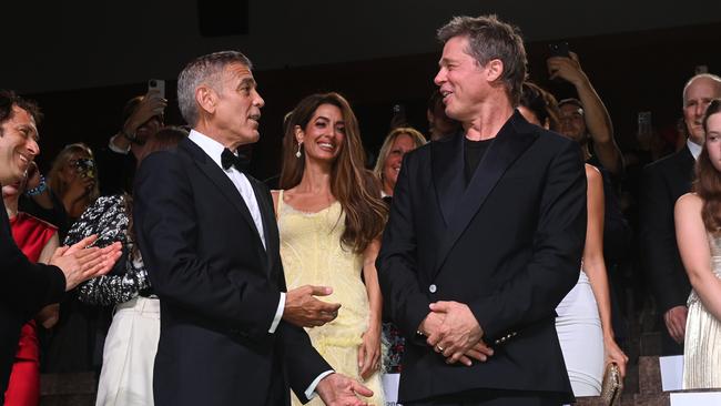 George Clooney and Brad Pitt promote Wolfs at Venice, with Clooney’s wife Amal, centre.