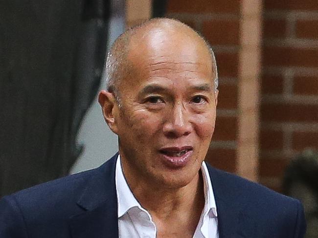 SYDNEY, AUSTRALIA - NCA Newswire Photos FEBRUARY 14 2022: Neurosurgeon Charlie Teo (left) and his fiancee Traci Griffiths arrive for a Health Care Complaints Commission Professional Standards Committee inquiry, in Sydney. Picture: NCA Newswire/ Gaye Gerard