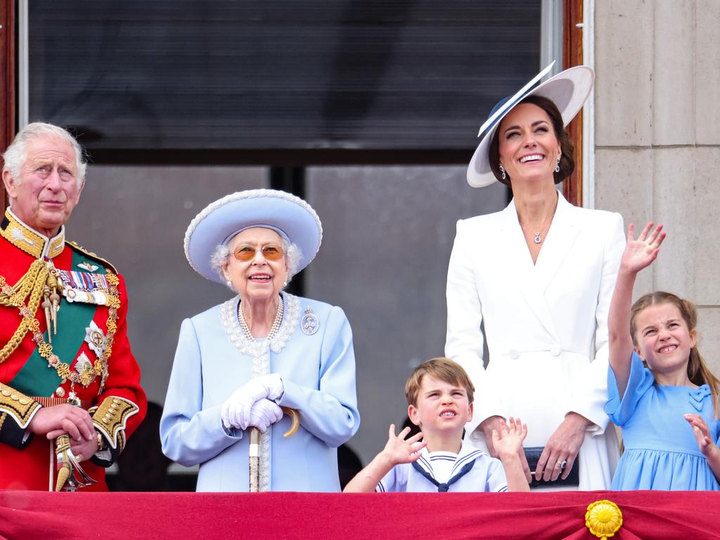 Kate Middleton with Prince Louis and Princess Charlotte beside the Queen and Prince Charles on the balcony of Buckingham Palace during the flypast. Picture: Getty Images