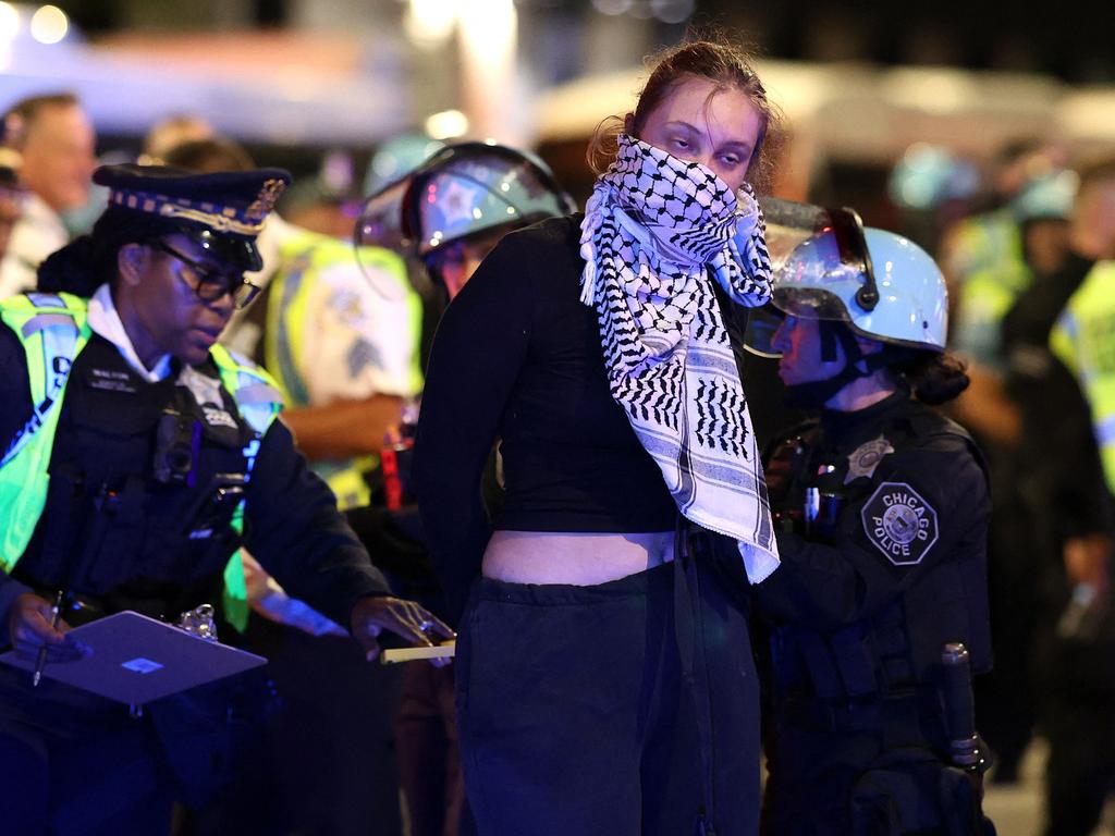 Police detain a demonstrator amid a protest at the Israeli consulate. Picture: AFP