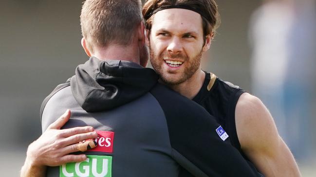 Matthew Scharenberg got a hug off his coach at training last week. Pic: AAP Image