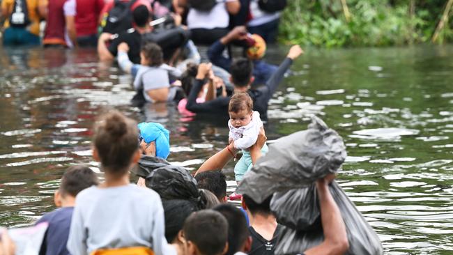 Migrants try to get to the US across the Rio Grande from Mexico in May last year. Picture: AFP