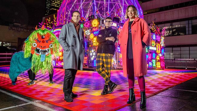 Gideon Obarzanek, artist Paul Yore and Hannah Fox with Yore’s sculpture at Golden Square, Seeing is Believing but Feeling is the Truth. Picture: Jake Nowakowski