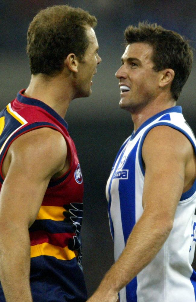 2003: Scriptwriters couldn’t have conjured this one. North Melbourne skipper Anthony Stevens came head-to-head with ex-skipper Wayne Carey. The on field clash happening after Carey’s return to the game following an affair with Stevens’ wife. Picture: George Salpigtidis