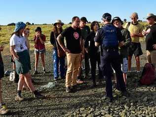 NSW Greens MPs Jeremy Buckingham and Dawn Walker were arrested by Queensland police after taking part in a blockade of the Adani Carmichael coal mine rail construction site at Belyando, 270km west of Bowen.