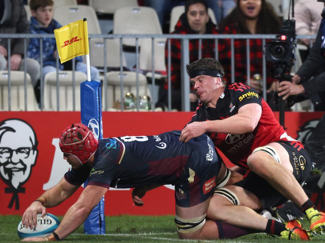 CHRISTCHURCH, NEW ZEALAND - MAY 27: 8. Harry Wilson from the Reds drives over to score in the tackle of Scott Barrett from the Crusaders during the round 15 Super Rugby Pacific match between the Crusaders and the Queensland Reds at Orangetheory Stadium on May 27, 2022 in Christchurch, New Zealand. (Photo by Peter Meecham/Getty Images)