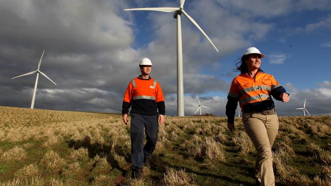 Site Manager Melanie Robertson and Technician Frank Cartledge at the Acciona Energy wind farm in Waubra Victoria.