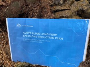 The activists also put Australia's Long-Term Emissions Reduction Plan on the pile. Picture: Extinction Rebellion