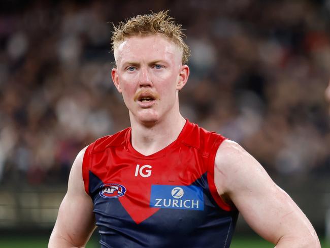 MELBOURNE, AUSTRALIA - SEPTEMBER 15: Clayton Oliver of the Demons looks dejected after a loss  during the 2023 AFL First Semi Final match between the Melbourne Demons and the Carlton Blues at Melbourne Cricket Ground on September 15, 2023 in Melbourne, Australia. (Photo by Dylan Burns/AFL Photos via Getty Images)