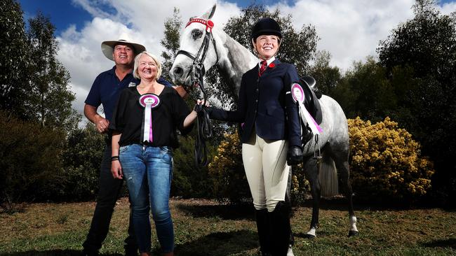 Paul Austin, equestrian coach from Queensland, Belinda Beltz, and Ava Halloran, 16, of Geelong, with Just an Enigma, the horse of Sarah Rose Beltz. Picture: NIKKI DAVIS-JONES