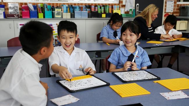 Students at Sydney Adventist School in Auburn in Sydney’s west, where classes have been successfully taught using old-school methods. Eric Ding, left, Owen Wang, Shirley Chen, Annie Chen, Deputy Principal Jenny Hahnel and Vini Ni. Picture: Jane Dempster