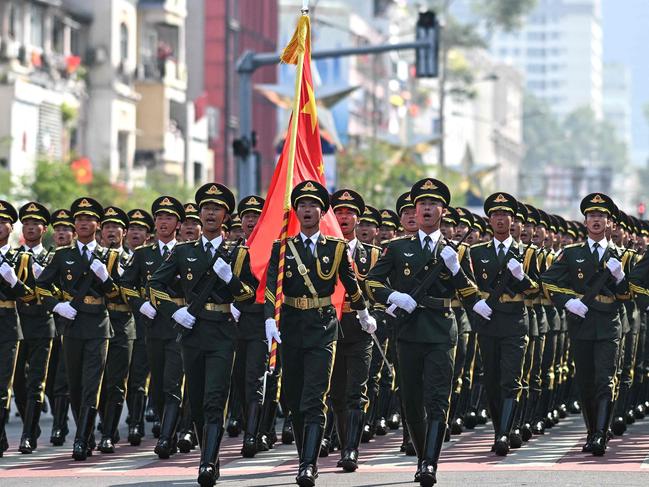 Chinese soldiers march during a parade marking the 50th anniversary of the fall of Saigon and the end of the Vietnam War in Ho Chi Minh City on April 30, 2025. Vietnam held its biggest celebration of the fall of Saigon on its 50th anniversary on April 30, including Chinese troops for the first time after Xi Jinping visited to portray Beijing as a more reliable partner than Washington. (Photo by MANAN VATSYAYANA / AFP)