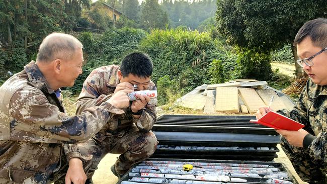 Technicians of Hunan Province Geological Disaster Survey and Monitoring Institute checking samples at the Wangu gold field. Picture: Getty