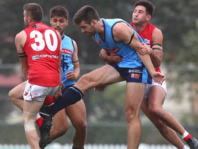 15.4.2018.SANFL: Sturt v North Adelaide at Unley Oval.Max Thring smothers a kick from Thomas Read and tackled by Aidan Tropiano.   PIC:TAIT SCHMAAL.