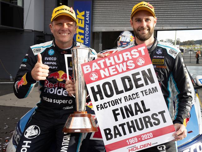 BATHURST, AUSTRALIA – OCTOBER 18: Drivers of the #97 Red Bull Holden Racing Team Holden Commodore ZB to celebrate after winning the Bathurst 1000. (Photo by Handout/Mark Horsburgh/Edge Photographics)