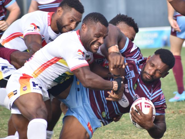 CQ Capras’ second rower Nixon Putt is wrapped up by the PNG Hunters’ defence.